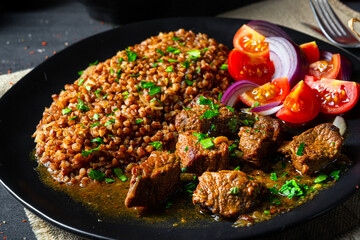 Buckwheat groats baked in the oven with beef goulash