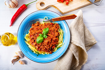 Delicious spaghetti bolognese on white background