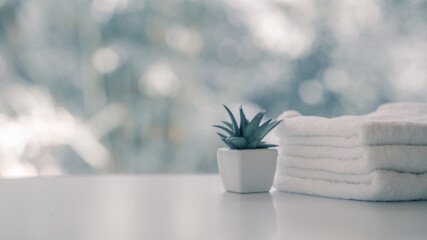 Towels on white top table with copy space on blurred background. For product display montage.