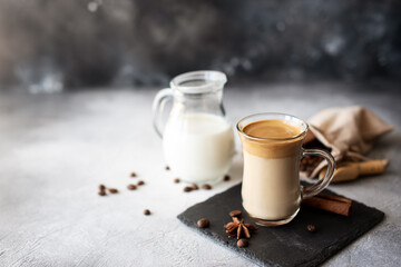 Dalgona coffee. Iced fluffy creamy whipped trend drink with coffee foam and milk. Trendy drink during Covid-19 city lock down and self quarantine, stay at home concept.