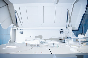 Automatic robot manipulator microbiologist analyzing test tube of blood samples for viruses. Concept vaccine search coronavirus 2019-nCoV