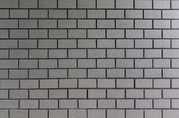 Texture of a wall of grey brick