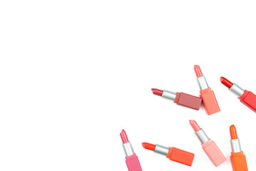 beautiful color pastel lipsticks arranged on white background with copy space,beauty and makeup concept