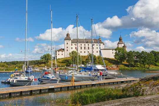 Summer idyll with sailboats at the bridge at Lacko Castle in Sweden