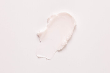 Facial cream splash on white background, top view 