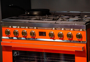The top panel of the gas stove is black
