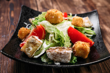 Caesar salad with fried tofu and deep-fried cheese