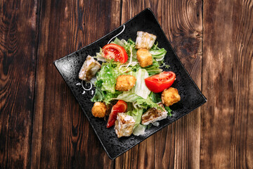 Caesar salad with fried tofu and deep-fried cheese