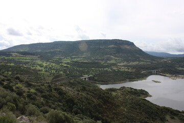 Temo lake in Sardinia, Monteleone Rocca Doria, aerial view, cloudy sky