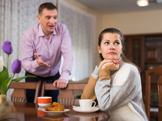 Frustrated woman while man rebuking her