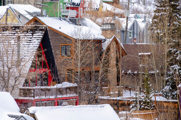 Fototapeta na wymiar Park City Utah neighborhood in winter with houses on snowy mountain slope
