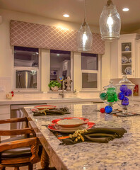 Table setting at the dining room of home with elegant furniture and tableware