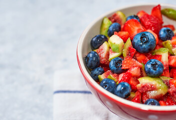 fig strawberry blueberry fruit salad, concept diet and healthy eating