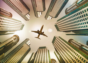 Plane encircled by buildings