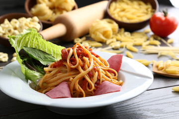 Delicious spaghetti served on a white plate.