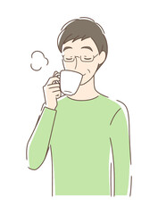 マグカップのコーヒーを飲む男性