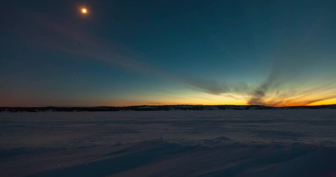 Lockdown time lapse shot of snow landscape against sky from sunset to night - Northwest Territories, Canada