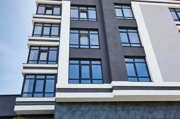 Modern apartment buildings on a sunny day with a blue sky. Facade of a modern European apartment building