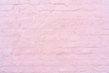 Pink brick wall. Facade of an old building. Architectural background.