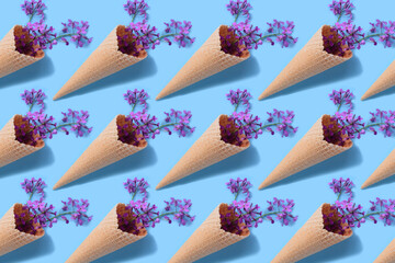 Pattern of bouquet of wild flowers in a waffle cone. Summer concept.
