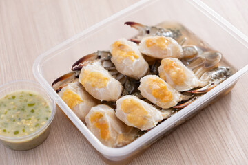 Crab in Fish-Sauce Marinated. Wooden background. Ready to eat