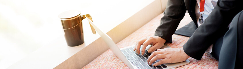 Business Woman is working in the office with a laptop to help with work.