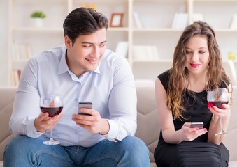 Young pair drinking wine in romantic concept