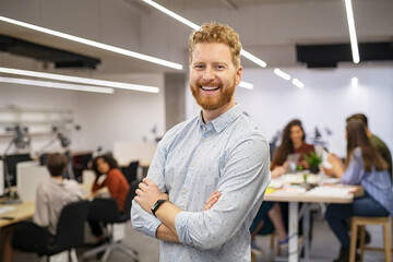 Successful business man smiling in office
