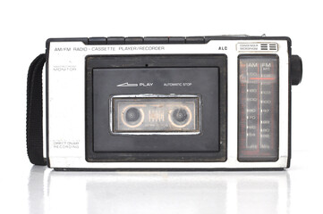Old vintage classic Cassette Player isolated against white background. Used in the 90s, 80s, collectibles retro style objects