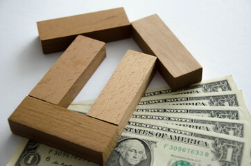 Closeup baby tree with coins on old wooden background. Business financce and saving money concpt.