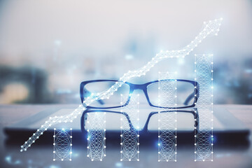 Financial graph hologram with glasses on the table background. Concept of business. Double exposure.