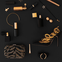 Luxury set of cosmetics and accessories in black and gold on a black background, layout, for design