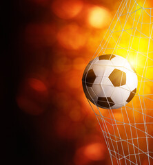 soccer ball in goal with spotlight