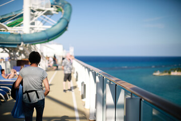 View of passengers on deck cruise chip Norwegian Getaway embark in port Jamaica.