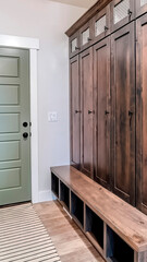 Vertical Home interior with fire door adjacent to the tall vintage wooden cabinet