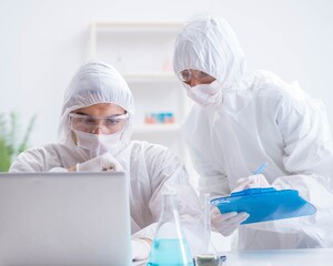 Two scientists working in the chemical lab