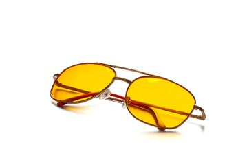 Yellow glasses isolated on a white background.
Anti-glare glasses for the driver in a metal frame with yellow glasses on white background.