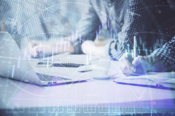 Multi exposure of forex chart with man working on computer on background. Concept of market analysis.