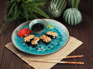Fresh and tasty sushi on the wooden table