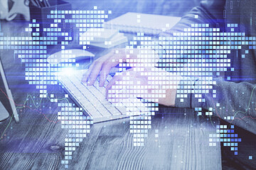 Multi exposure of businessman working on laptop on background. International business hologram in front. Concept of success.