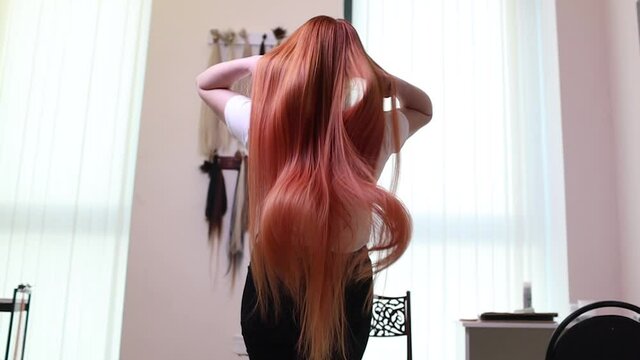 Hair salon, beauty spa. Procedure of hair extensions.