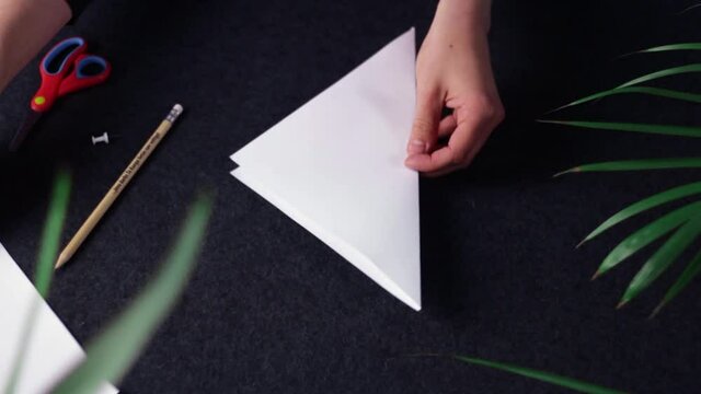 Crafting a paper boat diy top down shot 