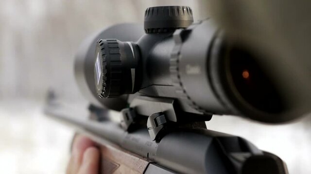 stock footage hunter with rifle with telescopic sight