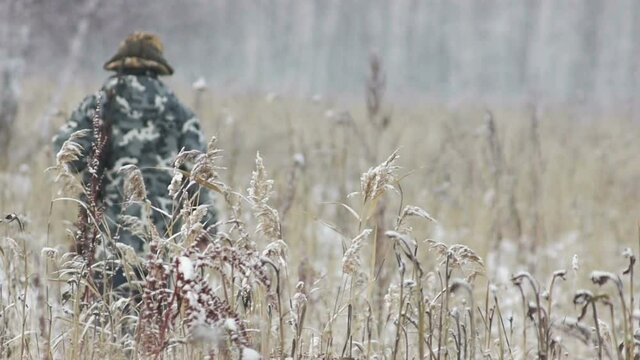 stock footage hunter with rifle with telescopic sight