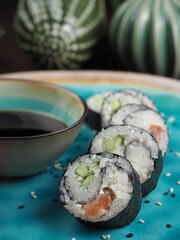 Fresh and tasty sushi on the wooden table