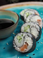 Fresh and tasty sushi on the wooden table