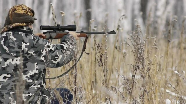 stock footage hunter with rifle with telescopic sight