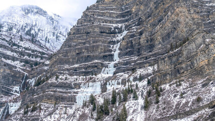 Panorama Rugged Provo canyon mountain view with frozen water and snow on the slopes