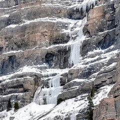 Fototapeta na wymiar Square Bridal Veil Falls with frozen water on steep slope during winter in Provo Canyon