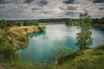 Obraz premium Turquoise lake Wapienniki near Sulejow, Lodzkie, Poland